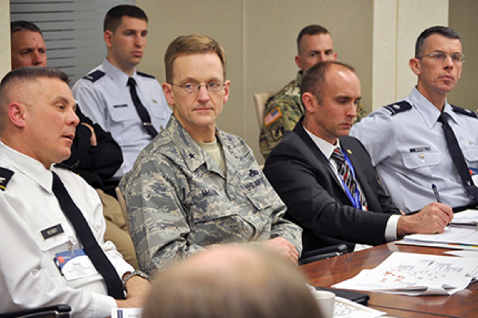 Defense Logistics Agency Energy Strategic Programs and Initiatives Director Army Col. Doug Henry, left, provides an overview of worldwide challenges and the current status of the fuel supply chain to Business Executives for National Security in a roundtable meeting at the BENS office in Washington, D.C., Feb. 9.