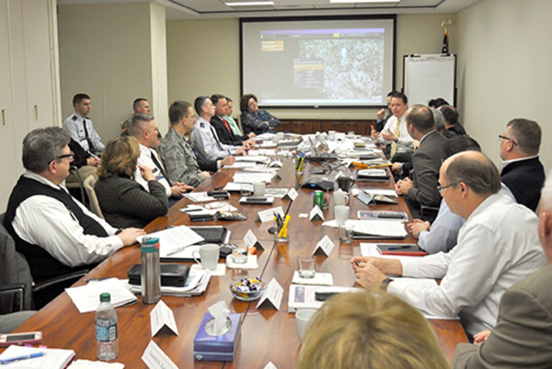 Defense Logistics Agency Energy senior leaders and business unit directors and Business Executives for National Security members gather around a conference table to discuss best commercial practices, lessons learned and the future of the study at the BENS office in Washington, D.C., Feb. 9.