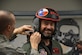 Actor Hugh Jackman has his helmet adjusted by Master Sgt. Jonathan Gibson, the 301st Operations Support Flight NCO in charge of the aircraft section, Feb. 19, 2016, at Naval Air Station Joint Reserve Base Fort Worth, Texas. Jackman flew in an F-16 Fighting Falcon above North Texas as part of a display of Air Force Reserve combat capability and air superiority. (U.S. Air Force photo/Staff Sgt. Samantha Mathison)