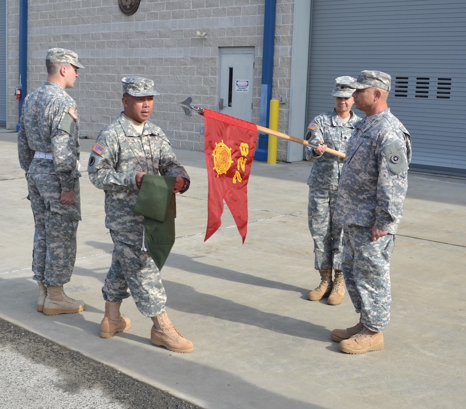 Master Sgt. Larry Garcia, 728th Transportation Company 1st Sgt., Chief Warrant Officer 3 Thomas Cruzramirez, 728th TC interim commander, and Lt. Col. Chandra M. Roberts, 469th Combat Sustainment Support Battalion commander, uncase the colors during the 728th Transportation Company activation ceremony at Mare Island, Vallejo, Calif., Feb. 20.