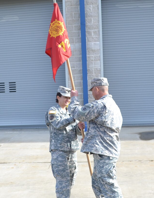 Lt. Col. Chandra M. Roberts, 469th Combat Sustainment Support Battalion commander, passes the guidon to Chief Warrant Officer 3 Thomas Cruzramirez, 728th TC interim commander, during an activation ceremony for the 728th Transportation Company at Mare Island, Vallejo, Calif., Feb. 20.