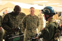 Morehead, Ky.-native Sgt. George R. Phillips, a SCAD squad leader with Identification and Detection Platoon, React Force Company, Chemical Biological Incident Response Force (CBIRF), describes the capabilities of the MultiRAE Chemical Detector to Sgt. Maj. Ronald L. Green, the 18th Sergeant Major of the Marine Corps, during an Initial Response Force static display in the battalion assembly room at CBIRF Headquarters, Naval Support Facility Indian Head, Feb. 18, 2016.
Green visited the Marines, sailors and civilians with CBIRF at Naval Support Facility Indian Head and Raymond M. Downey Responder Training Facility.
During Green’s visit, he received a CBIRF brief given by the CBIRF Commanding Officer, Col. Stephen E. Redifer, viewed a static display of an Initial Response Force set-up, talked to CBIRF personnel, toured the Downey Responder Training Facility and had lunch with CBIRF staff noncommissioned officers. 
When directed, CBIRF forward-deploys and/or responds with minimal warning to a chemical, biological, radiological, nuclear or high-yield explosive (CBRNE) threat or event in order to assist local, state, or federal agencies and the geographic combatant commanders in the conduct of CBRNE response or consequence management operations, providing capabilities for command and control; agent detection and identification; search, rescue, and decontamination; and emergency medical care for contaminated personnel. (Official USMC Photo by Sgt. Santiago G. Colon Jr./RELEASED)
