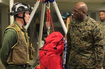 Bloomsbury, N.J. - native Cpl. Alexander Baguskis, a team member with Technical Rescue Platoon, React Force Company, Chemical Biological Incident Response Force (CBIRF), speaks to Sgt. Maj. Ronald L. Green, the 18th Sergeant Major of the Marine Corps, during an Initial Response Force static display in the battalion assembly room at CBIRF Headquarters, Naval Support Facility Indian Head, Feb. 18, 2016.
Green visited the Marines, sailors and civilians with CBIRF at Naval Support Facility Indian Head and Raymond M. Downey Responder Training Facility.
During Green’s visit, he received a CBIRF brief given by the CBIRF Commanding Officer, Col. Stephen E. Redifer, viewed a static display of an Initial Response Force set-up, talked to CBIRF personnel, toured the Downey Responder Training Facility and had lunch with CBIRF staff noncommissioned officers. 
When directed, CBIRF forward-deploys and/or responds with minimal warning to a chemical, biological, radiological, nuclear or high-yield explosive (CBRNE) threat or event in order to assist local, state, or federal agencies and the geographic combatant commanders in the conduct of CBRNE response or consequence management operations, providing capabilities for command and control; agent detection and identification; search, rescue, and decontamination; and emergency medical care for contaminated personnel. (Official USMC Photo by Sgt. Santiago G. Colon Jr./RELEASED)
