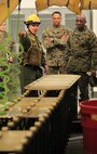 Miami, Fla.- native Sgt. David O. Ortiz, a team leader with Decontamination Platoon, React Force Company, Chemical Biological Incident Response Force (CBIRF), explains the procedures for the non-ambulatory casualty decontamination line to Sgt. Maj. Ronald L. Green, the 18th Sergeant Major of the Marine Corps, during an Initial Response Force static display in the battalion assembly room at CBIRF Headquarters, Naval Support Facility Indian Head, Feb. 18, 2016.
Green visited the Marines, sailors and civilians with CBIRF at Naval Support Facility Indian Head and Raymond M. Downey Responder Training Facility.
During Green’s visit, he received a CBIRF brief given by the CBIRF Commanding Officer, Col. Stephen E. Redifer, viewed a static display of an Initial Response Force set-up, talked to CBIRF personnel, toured the Downey Responder Training Facility and had lunch with CBIRF staff noncommissioned officers. 
When directed, CBIRF forward-deploys and/or responds with minimal warning to a chemical, biological, radiological, nuclear or high-yield explosive (CBRNE) threat or event in order to assist local, state, or federal agencies and the geographic combatant commanders in the conduct of CBRNE response or consequence management operations, providing capabilities for command and control; agent detection and identification; search, rescue, and decontamination; and emergency medical care for contaminated personnel. (Official USMC Photo by Sgt. Santiago G. Colon Jr./RELEASED)

