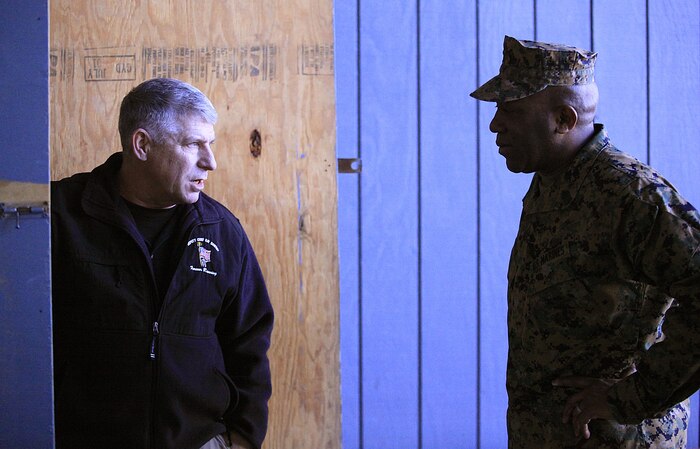 Retired Marine Master Sgt. Patrick Higgins,left, lead instructor at Raymond M. Downey Responder Training Facility guides Sgt. Maj. Ronald L. Green, the 18th Sergeant Major of the Marine Corps, through a tour of the facility where every Chemical Biological Incident Response Force (CBIRF) Marine trains to respond to Chemical, Biological, Radiological, Nuclear and High-Yield Explosives (CBRNE) incidents, Feb. 18, 2016. Downey Responder Training Facility is located at Naval Annex Stump Neck, Md. 
Green visited the Marines, sailors and civilians with CBIRF at Naval Support Facility Indian Head and Downey Responder Training Facility.
During Green’s visit, he received a CBIRF brief given by the CBIRF Commanding Officer, Col. Stephen E. Redifer, viewed a static display of an Initial Response Force set-up, talked to CBIRF personnel, toured the Downey Responder Training Facility and had lunch with CBIRF staff noncommissioned officers. 
When directed, CBIRF forward-deploys and/or responds with minimal warning to a chemical, biological, radiological, nuclear or high-yield explosive (CBRNE) threat or event in order to assist local, state, or federal agencies and the geographic combatant commanders in the conduct of CBRNE response or consequence management operations, providing capabilities for command and control; agent detection and identification; search, rescue, and decontamination; and emergency medical care for contaminated personnel. (Official USMC Photo by Sgt. Santiago G. Colon Jr./RELEASED) 
