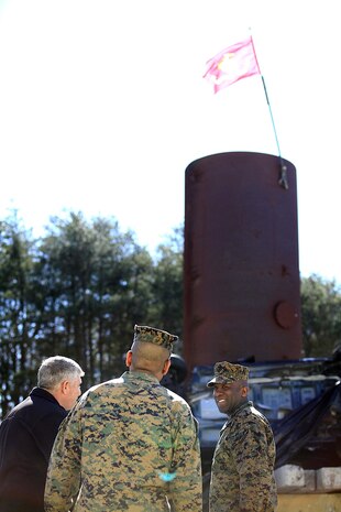 Sgt. Maj. Ronald L. Green, the 18th Sergeant Major of the Marine Corps, takes a look at pile of wrecked vehicles and debris used for technical rescue training at Raymond M. Downey Responder Training Facility, Naval Annex Stump Head, Md., Feb. 18, 2016.
Green visited the Marines, sailors and civilians with Chemical Biological Incident Response Force (CBIRF) at Naval Support Facility Indian Head and Downey Responder Training Facility.
During Green’s visit, he received a CBIRF brief given by the CBIRF Commanding Officer, Col. Stephen E. Redifer, viewed a static display of an Initial Response Force set-up, talked to CBIRF personnel, toured the Downey Responder Training Facility and had lunch with CBIRF staff noncommissioned officers. 
When directed, CBIRF forward-deploys and/or responds with minimal warning to a chemical, biological, radiological, nuclear or high-yield explosive (CBRNE) threat or event in order to assist local, state, or federal agencies and the geographic combatant commanders in the conduct of CBRNE response or consequence management operations, providing capabilities for command and control; agent detection and identification; search, rescue, and decontamination; and emergency medical care for contaminated personnel. (Official USMC Photo by Sgt. Santiago G. Colon Jr./RELEASED)
