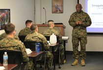 Sgt. Maj. Ronald L. Green, the 18th Sergeant Major of the Marine Corps, speaks to Chemical Biological Incident Response Force (CBIRF) Corporals Course participants during Green’s tour of Raymond M. Downey Responder Training Facility, Naval Annex Stump Head, Md., Feb. 18, 2016.
Green visited the Marines, sailors and civilians with CBIRF at Naval Support Facility Indian Head and Raymond M. Downey Responder Training Facility.
During Green’s visit, he received a CBIRF brief given by the CBIRF Commanding Officer, Col. Stephen E. Redifer, viewed a static display of an Initial Response Force set-up, talked to CBIRF personnel, toured the Downey Responder Training Facility and had lunch with CBIRF staff noncommissioned officers. 
When directed, CBIRF forward-deploys and/or responds with minimal warning to a chemical, biological, radiological, nuclear or high-yield explosive (CBRNE) threat or event in order to assist local, state, or federal agencies and the geographic combatant commanders in the conduct of CBRNE response or consequence management operations, providing capabilities for command and control; agent detection and identification; search, rescue, and decontamination; and emergency medical care for contaminated personnel. (Official USMC Photo by Sgt. Santiago G. Colon Jr./RELEASED)
