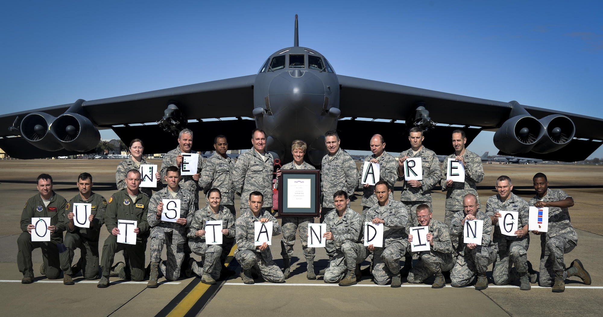 Col. Kristin Goodwin, center, 2nd Bomb Wing commander, and 2nd BW leadership pose for a photo at Barksdale Air Force Base, La., Jan. 28, 2016. The 2nd BW was awarded with the Air Force Outstanding Unit Award for exceptional meritorious service during 2014. (U.S. Air Force photo/Airman 1st Class Mozer O. Da Cunha)