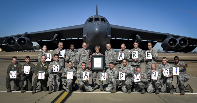 Col. Kristin Goodwin, center, 2nd Bomb Wing commander, and 2nd BW leadership pose for a photo at Barksdale Air Force Base, La., Jan. 28, 2016. The 2nd BW was awarded with the Air Force Outstanding Unit Award for exceptional meritorious service during 2014. (U.S. Air Force photo/Airman 1st Class Mozer O. Da Cunha)