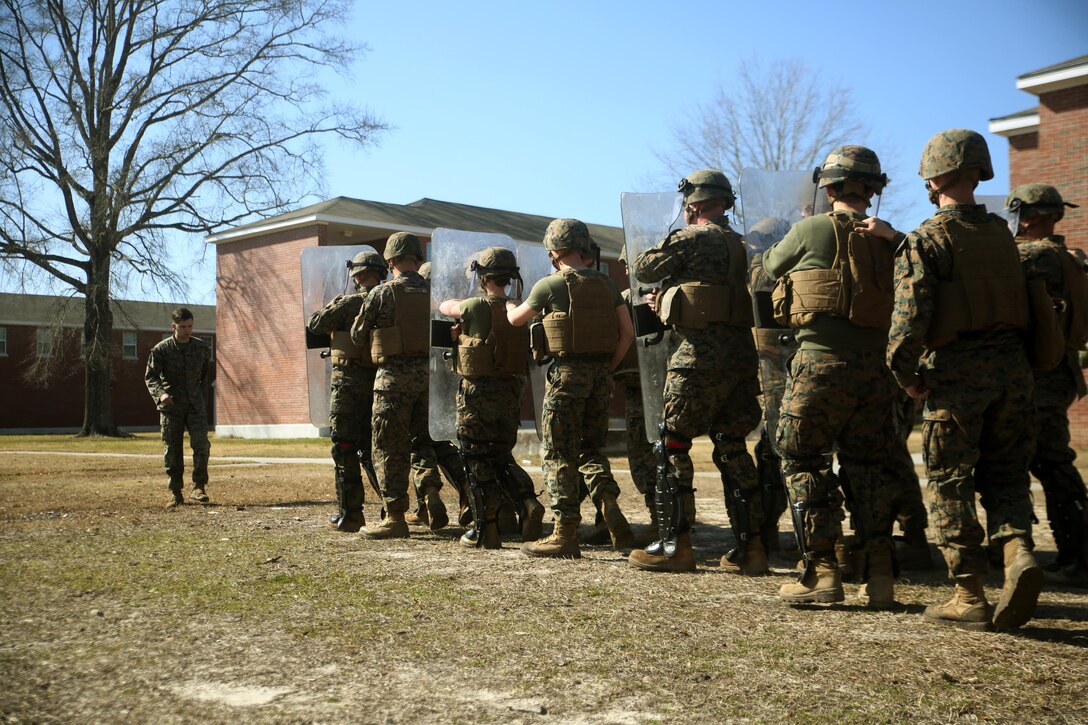 Marines with Combat Logistics Battalion 2 practice formations during non-lethal riot control training at Camp Lejeune, N.C., Feb. 18, 2016.  The training is in preparation for the unit’s upcoming Special Purpose Marine Air-Ground Task Force-Crisis Response-Africa deployment later this year. (U.S. Marine Corps photo by Cpl. Joey Mendez)