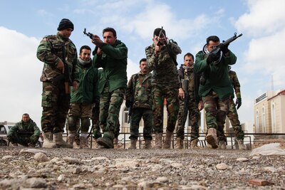 Peshmerga soldiers rehearse urban tactical movement at a training base near Irbil, Iraq, Jan. 26, 2016. Peshmerga soldiers attend a six-week infantry basic course that will help improve their tactical knowledge to aid in the fight against the Islamic State of Iraq and the Levant. There are six Combined Joint Task Force Operation Inherent Resolve training locations: four building partner capacity sites and two building specialized training sites. Army photo by Spc. Jessica Hurst