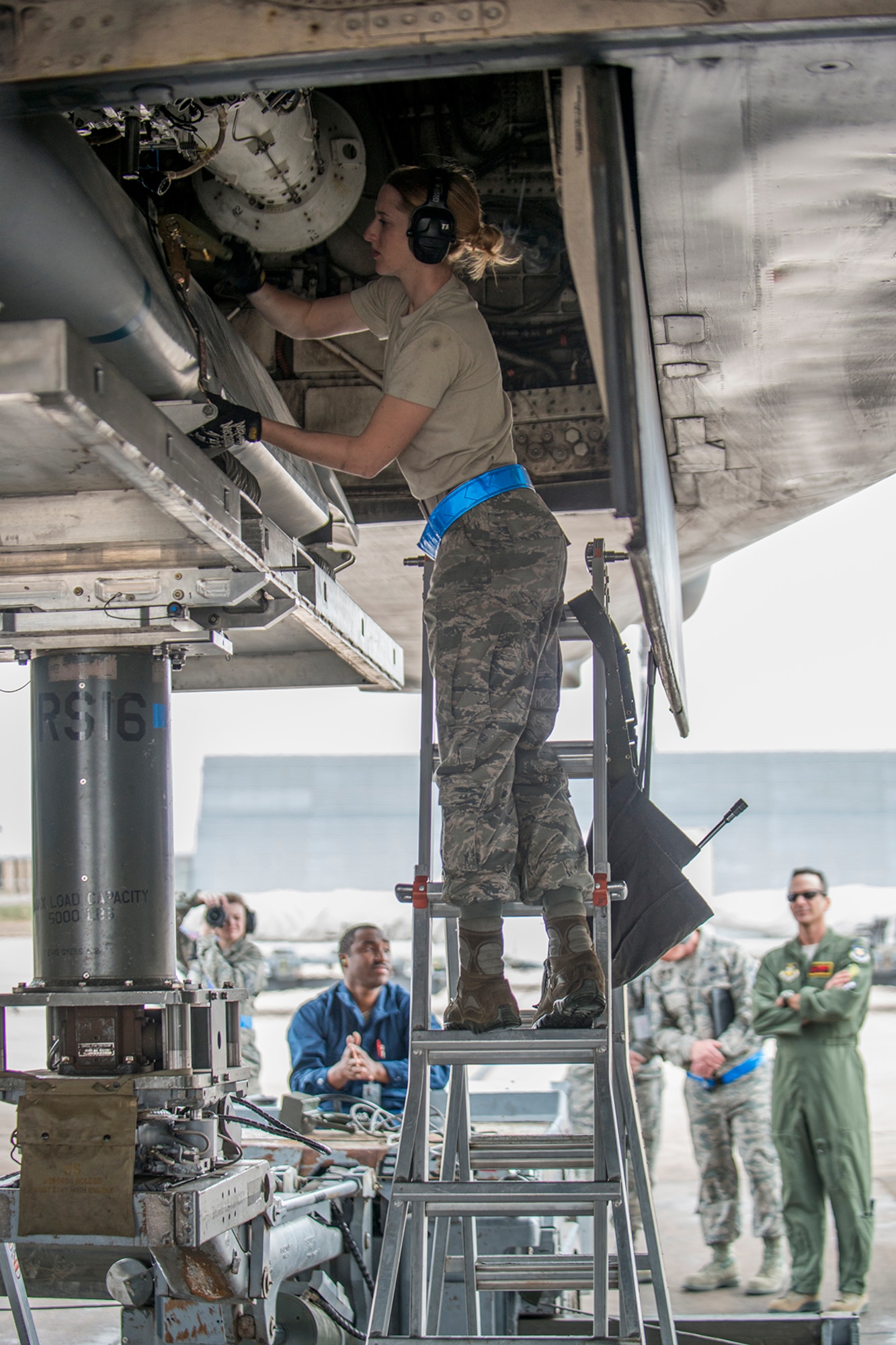 A weapons load crew member assigned to the 489th Maintenance Squadron secures a tie-down strap on a Joint Air-to-Surface Standoff Weapon during a downloading operation from the bomb bay of a B-1 Lancer on Feb. 21, 2016, Dyess Air Force Base, Texas. Members of the Air Force Reserve Command’s 489th Bomb Group participated in an exercise alongside their Active Duty counterparts from the 7th Maintenance Squadron. (U.S. Air Force photo by Master Sgt. Greg Steele/Released)