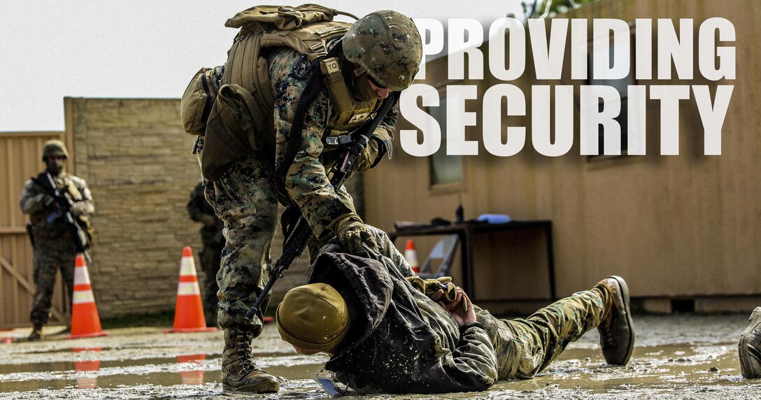 Marines with Bravo Company, 2nd Law Enforcement Battalion, subdue role players after a notional altercations at a forward observation base during an interior guard training exercise at Forward Observation Base Hawk at Camp Lejeune, N.C., Feb. 17, 2016. The training prepared Marines to conduct real-life site security operations. (U.S. Marine Corps illustration by Lance Cpl. Erick Galera/Released)