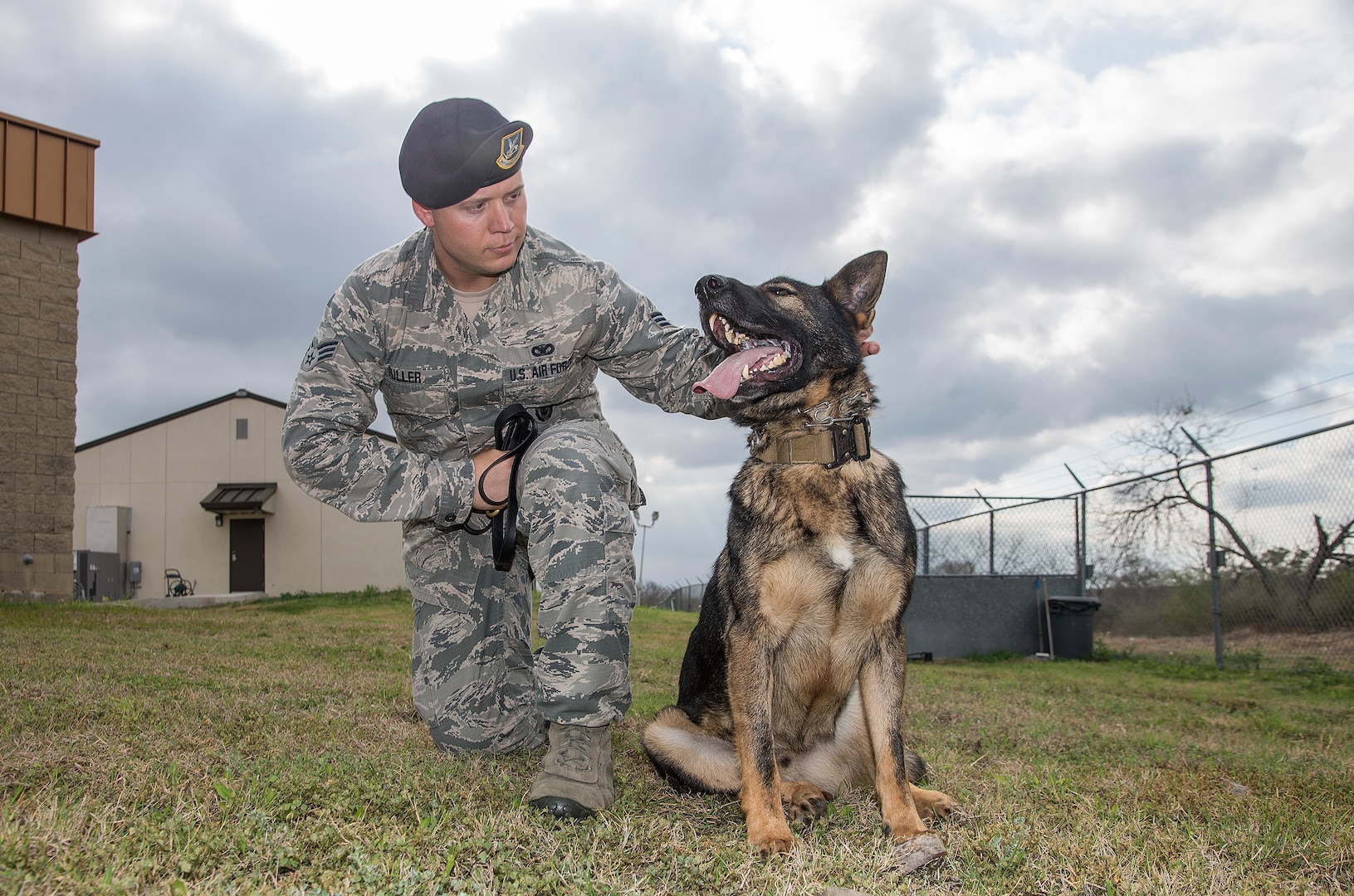Senior Airman Jordan Full, 802nd Security Force Squadron military working dog handler, poses with Rocco, his MWD, Feb. 23, at Joint Base San Antonio-Lackland Medina Annex. Canines with the MDW program are trained in various skills such as detecting explosives and narcotics, and apprehending suspects. 