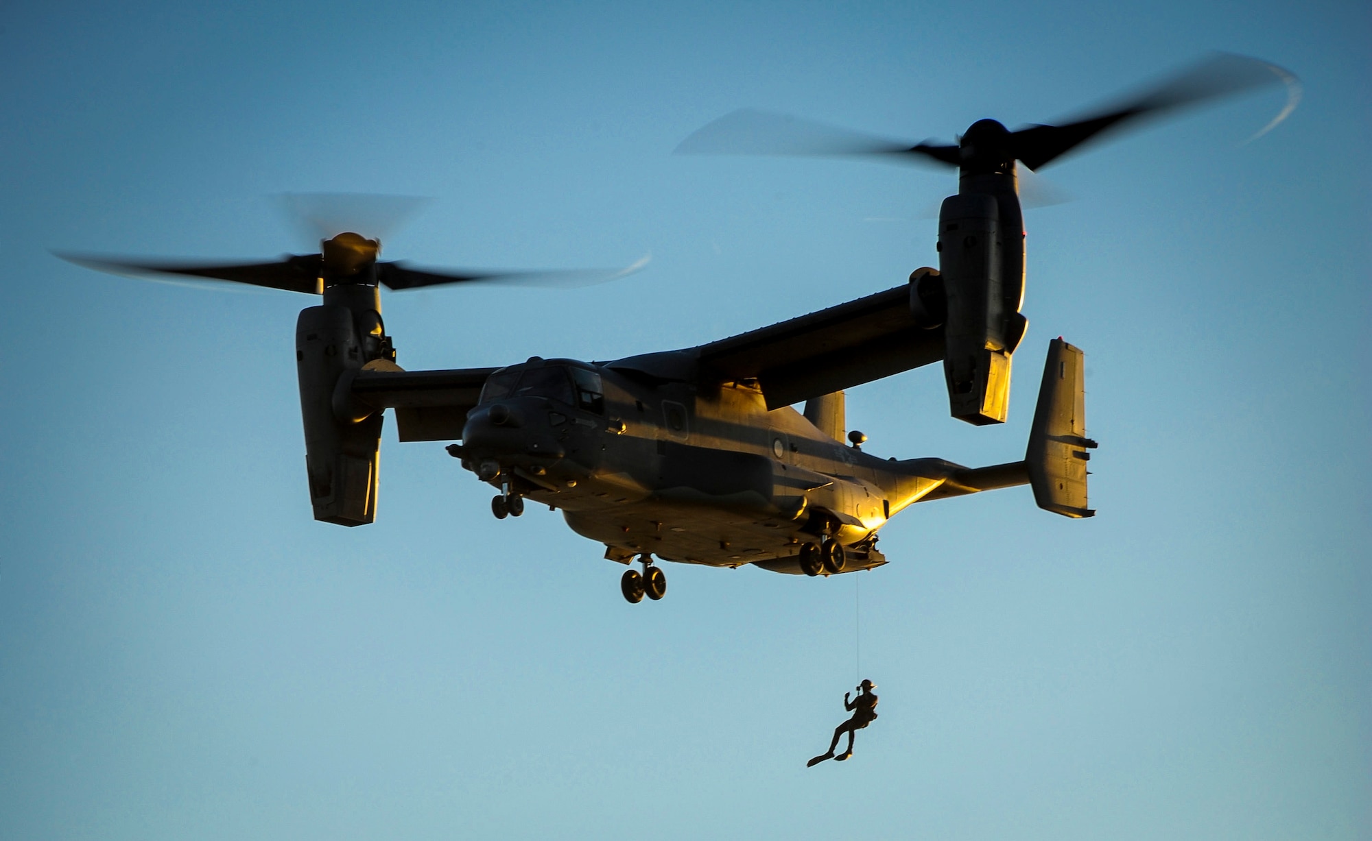 A pararescueman with the 24th Special Operations Wing repels from a 8th Special Operations Squadron CV-22B Osprey during a demonstration at Hurlburt Field, Fla., Feb. 18, 2016. The demonstration showcased Air Force Special Operations Command capabilities for the John L. Hennessy Award evaluators as Hurlburt Field was named top nominee for the award. The Hennessy Award recognizes the best food service programs in the Air Force, as well as individual excellence. (U.S. Air Force photo by Senior Airman Meagan Schutter)