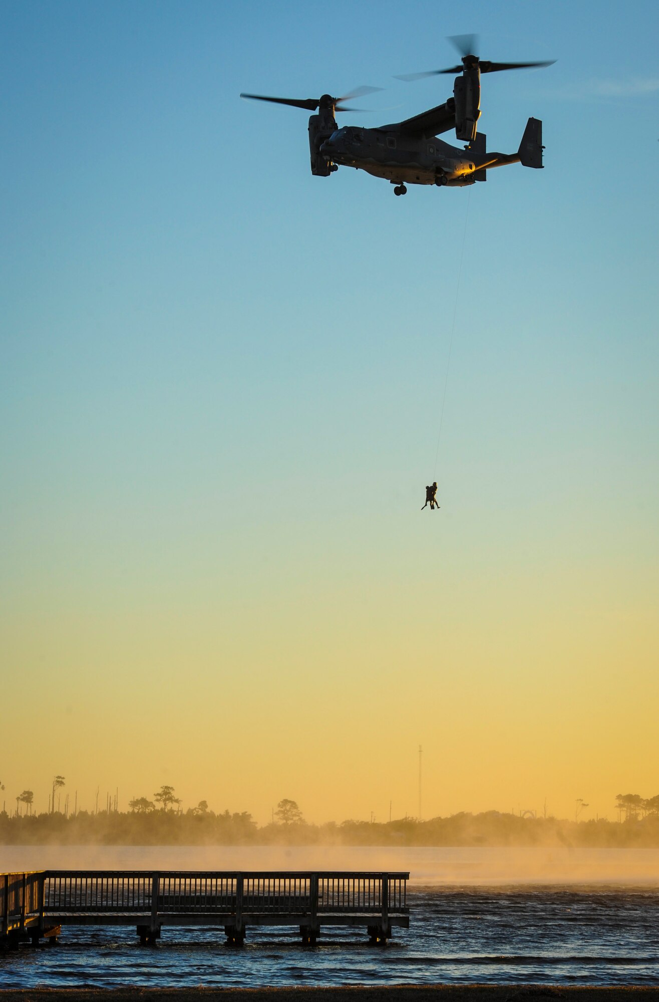 Pararescuemen with the 24th Special Operations Wing are lifted into a 8th Special Operations Squadron CV-22B Osprey during a demonstration at Hurlburt Field, Fla., Feb. 18, 2016. The demonstration showcased Air Force Special Operations Command capabilities for the John L. Hennessy Award evaluators as Hurlburt Field was named top nominee for the award. The Hennessy Award recognizes the best food service programs in the Air Force, as well as individual excellence. (U.S. Air Force photo by Senior Airman Meagan Schutter)