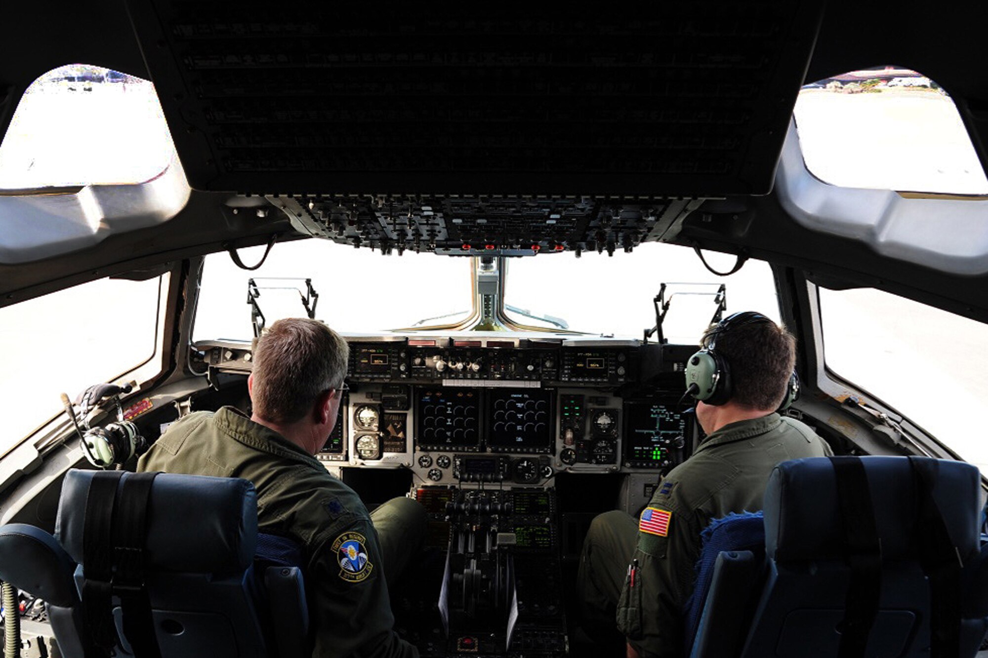 Lt. Col. Mark Laverne and Capt. Scott Fredrickson, 317th Airlift Squadron pilots, conduct pre-flight checklists aboard a C-17 Globemaster III during training exercise Patriot Sands Feb. 17, 2016, at Hunter Army Airfield, Georgia. (U.S. Air Force Photo by Senior Airman Jonathan Lane)