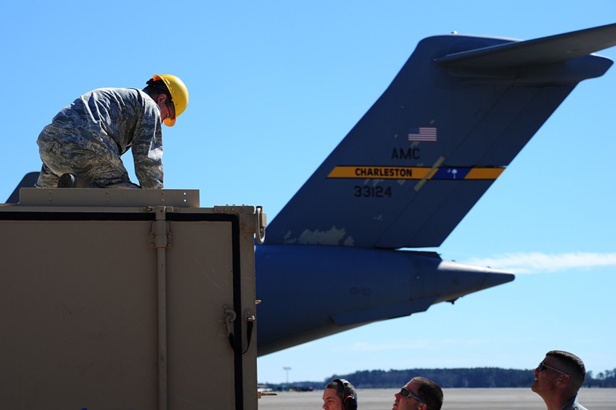 Members of the 315th Airlift Control Flight construct the HELAMS during training exercise Patriot Sands Feb. 17, 2016, at Hunter Army Airfield, Georgia. (U.S. Air Force Photo by Senior Airman Jonathan Lane)