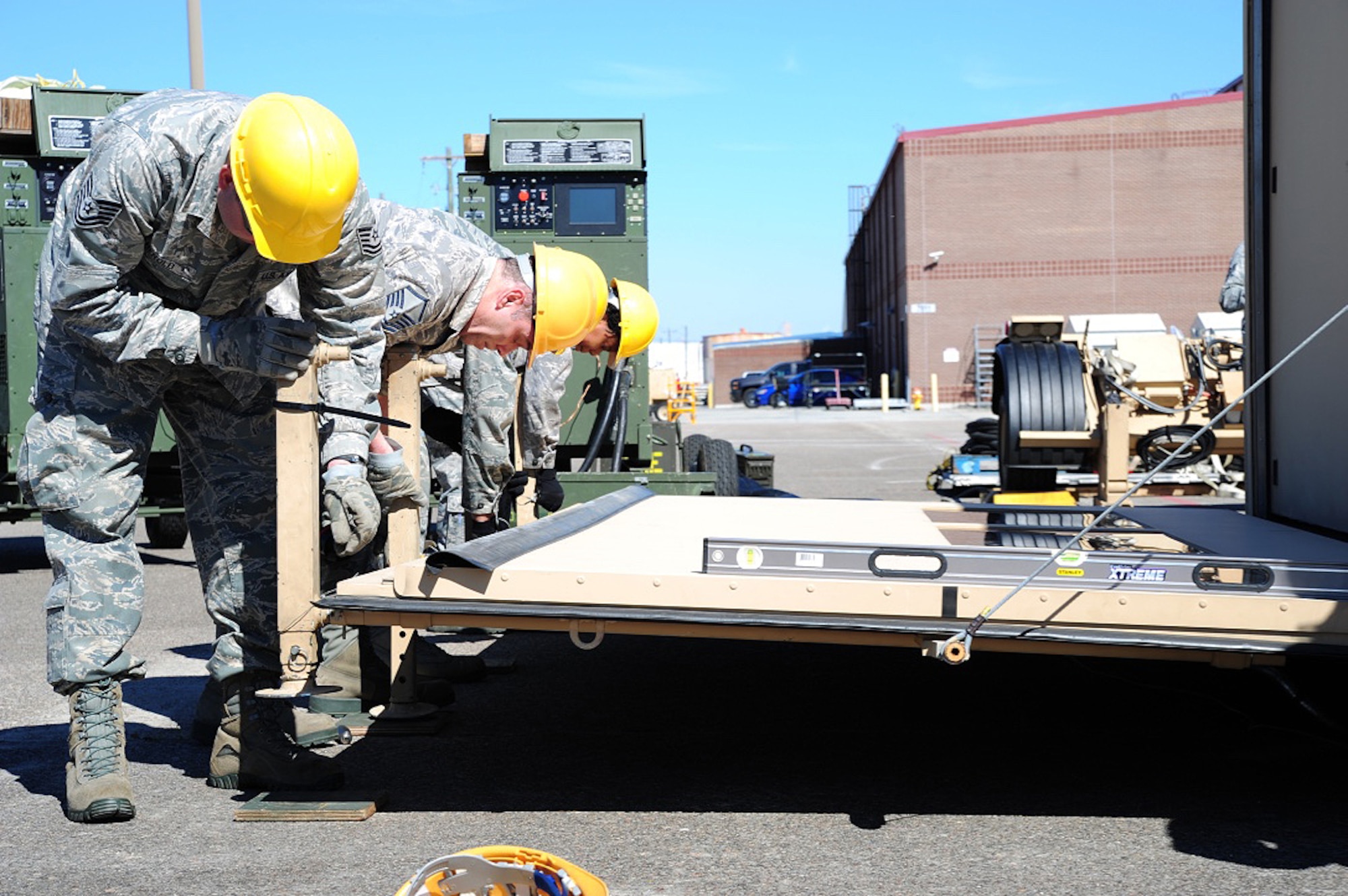 Members of the 315th Airlift Control Flight construct the HELAMS during training exercise Patriot Sands Feb. 17, 2016, at Hunter Army Airfield, Georgia. (U.S. Air Force Photo by Senior Airman Jonathan Lane)