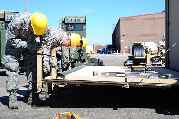 Members of the 315th Airlift Control Flight construct a hardside expandable light air mobility shelter during training exercise Patriot Sands Feb. 17, 2016, at Hunter Army Airfield, Ga. (U.S. Air Force Photo/Senior Airman Jonathan Lane)