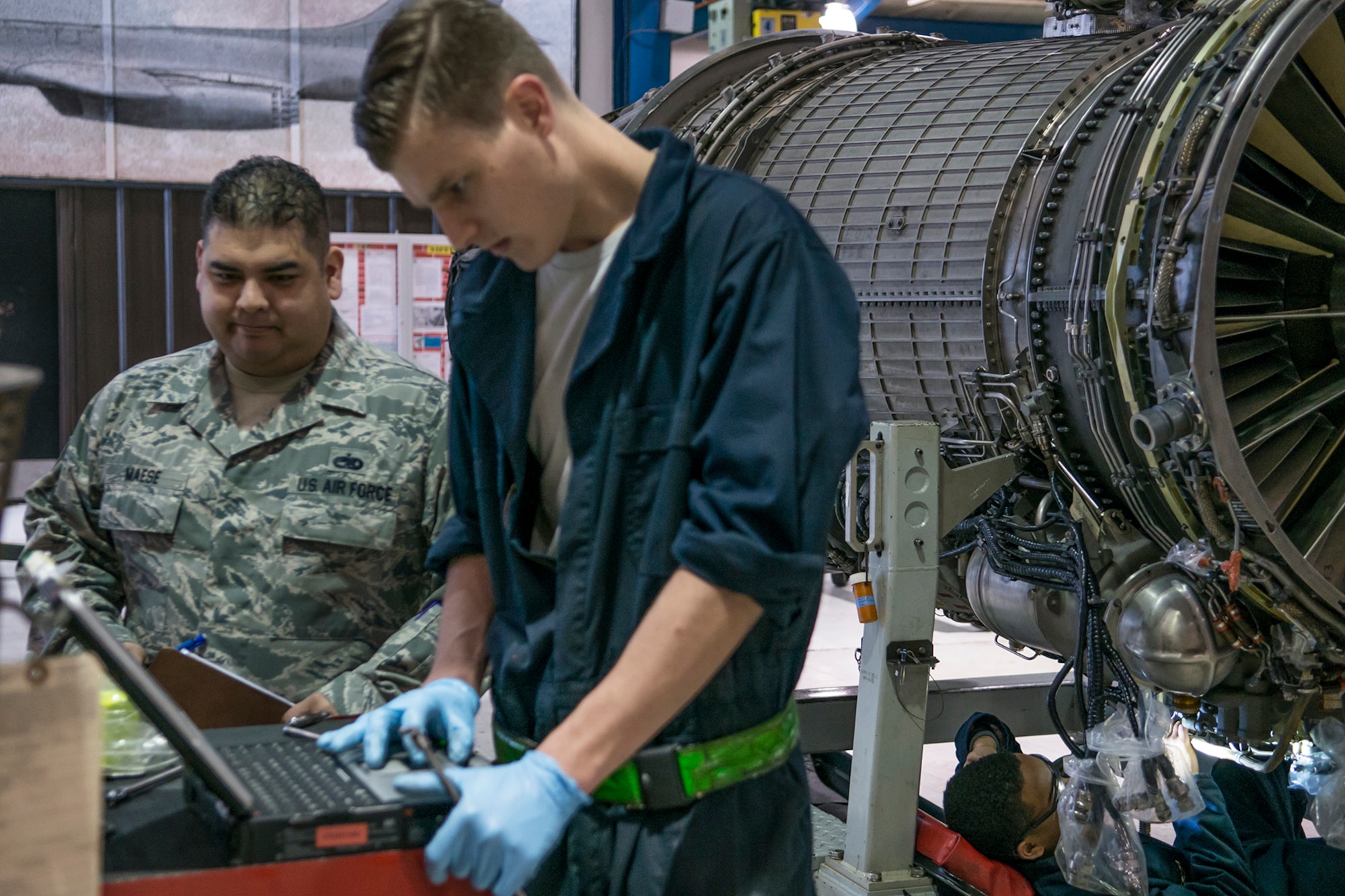 U.S. Air Force Tech. Sgt. Jeffrey Maese, 489th Maintenance Squadron (MXS) propulsion shop production superintendent, looks on as Senior Airman Matthew Waliszewski reads jet engine technical orders on Feb. 22, 2016, Dyess Air Force Base (AFB), Texas. The 489th MXS is assigned to the Air Force Reserve Command’s 489th Bomb Group at Dyess, which assigned to the 307th Bomb Wing at Barksdale Air Force Base, La. (U.S. Air Force photo by Master Sgt. Greg Steele/Released)