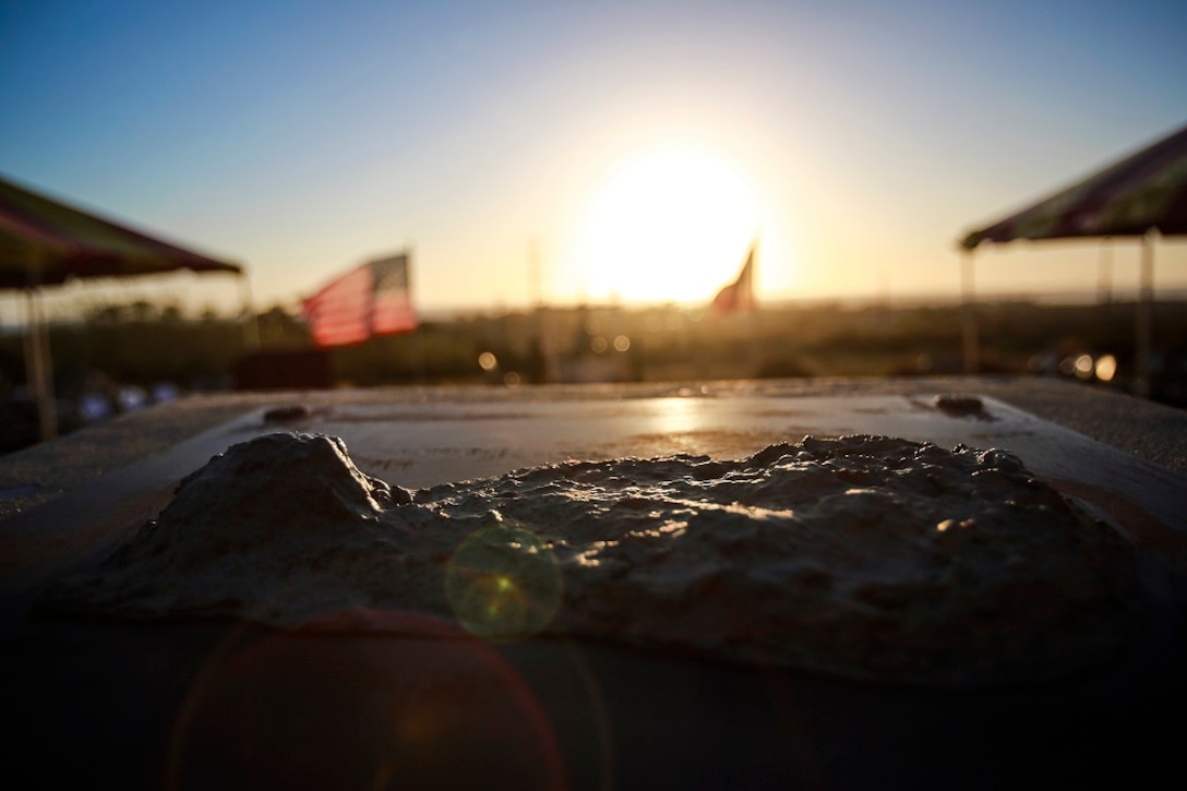 The sun sets over a commemorative statue of the island of Iwo Jima after the 71st anniversary memorial ceremony for the of the Battle of Iwo Jima, Feb. 20 at Marine Corps Base Camp Pendleton, Calif. During the 36-day battle for the 8.5 square-mile island, 6,821 Marines gave their lives to gain control of the strategic position in the Pacific during World War II. 