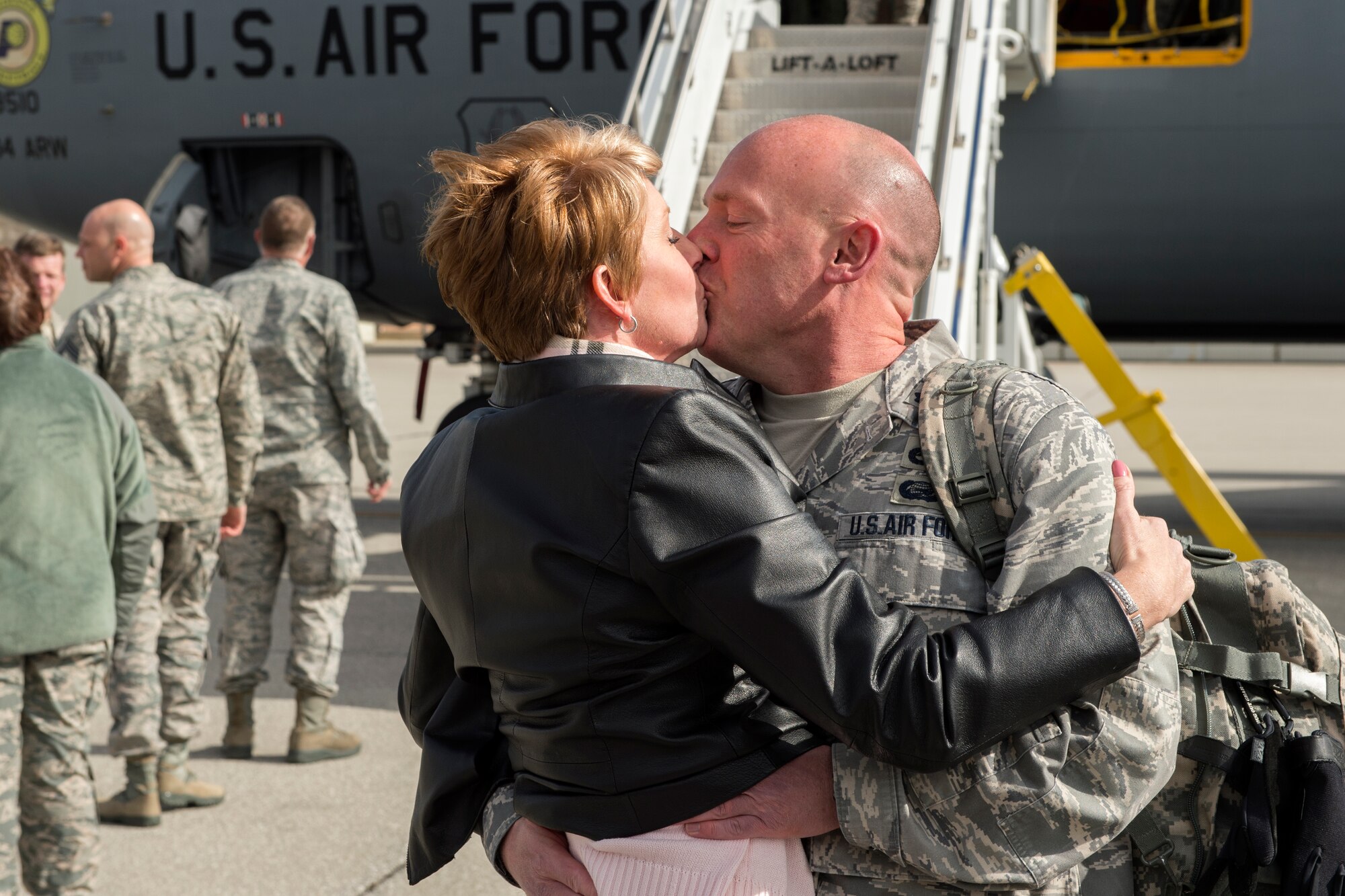 Lt. Col Joel Brecount, 434th Aircraft Maintenance commander, kisses his wife, Tia Brecount, after returning to Grissom Air Reserve Base from a deployment to Southwest Asia Feb. 7, 2016.  In addition to family members, other Airmen and leadership from Grissom stood by to greet the members after a 4-month deployment in support of Operation Inherent Resolve. (U.S. Air Force photo/Tech. Sgt. Benjamin Mota)