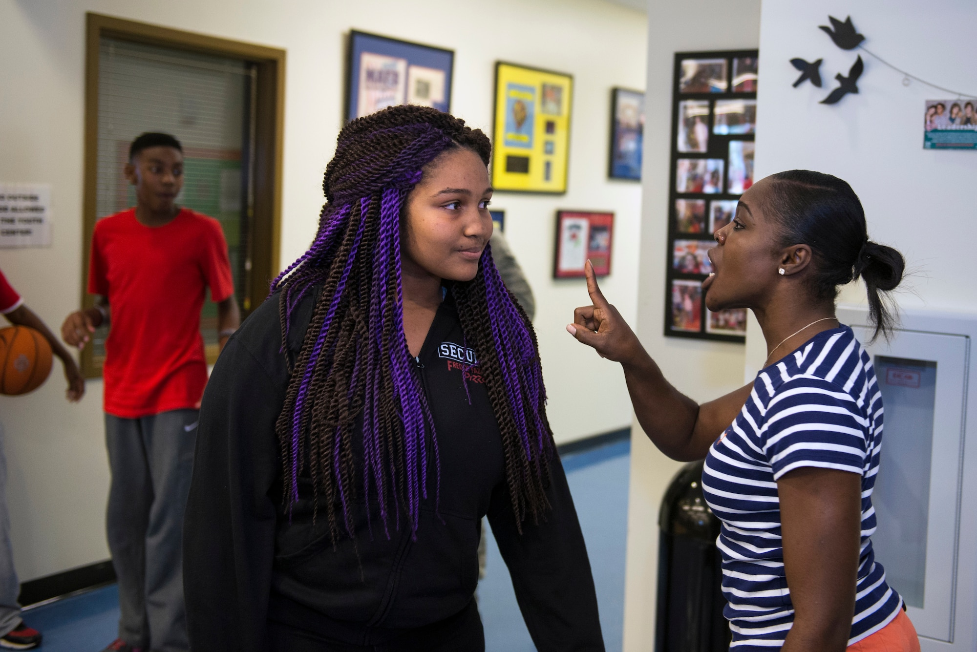 Ashleigh Stafford, Moody Youth Program child and youth program assistant, disciplines Iolani Hardin, daughter of U.S. Air Force Chief Master Sgt. Will Hardin, 23d Civil Engineer Squadron, during a simulated teen violence skit as a part of the “Teens Preparing for the Real World” seminar, Feb. 20, 2016, at Moody Air Force Base, Ga. The skit was designed to raise awareness about abusive teen relationships as a part of February’s National Teen Dating Violence Prevention Month. (U.S. Air Force photo by Airman 1st Class Greg Nash/Released)  