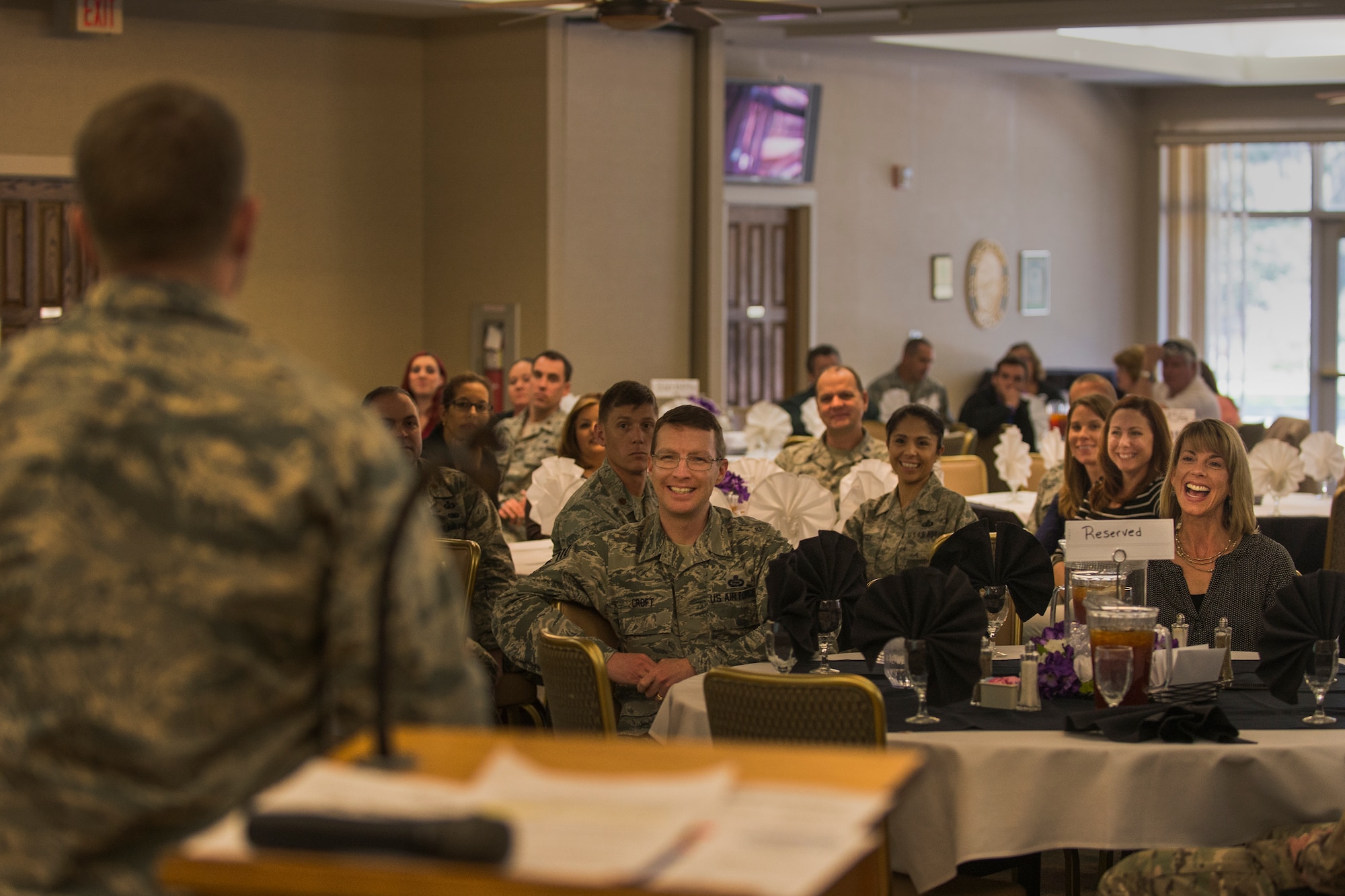 U.S Air Force Maj. Brandon Wengert, 23d Force Support Squadron commander, entertains the crowd with his presentation during the Key Spouses’ luncheon, Feb. 18, 2016, at Moody Air Force Base, Ga. Moody leadership hosted the luncheon to show appreciation for Key Spouses and all they do for Moody’s Airmen. (U.S. Air Force photo by Airman Daniel Snider/Released) 