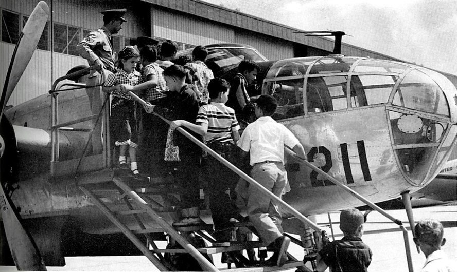 Children scramble to get an up-close view of the cockpit of a B-25 Mitchell during the open house held on Armed Forces Day at Shaw Air Force Base, S.C., May 15, 1954. The B-25, a twin-engine medium bomber, was famous for its use in the Doolittle Raid on Tokyo, Japan, April 18, 1942. (Photo courtesy of 20th Fighter Wing historian)