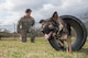Senior Airman Jordan Fuller, 802nd Security Forces Squadron military working dog handler, and his MWD, Rocco, perform maneuvers Feb. 23, at Joint Base San Antonio-Lackland Medina Annex. Handlers regularly practice obedience training with their working dogs to increase their team cohesiveness. (U.S. Air Force photo by Johnny Saldivar/released) 