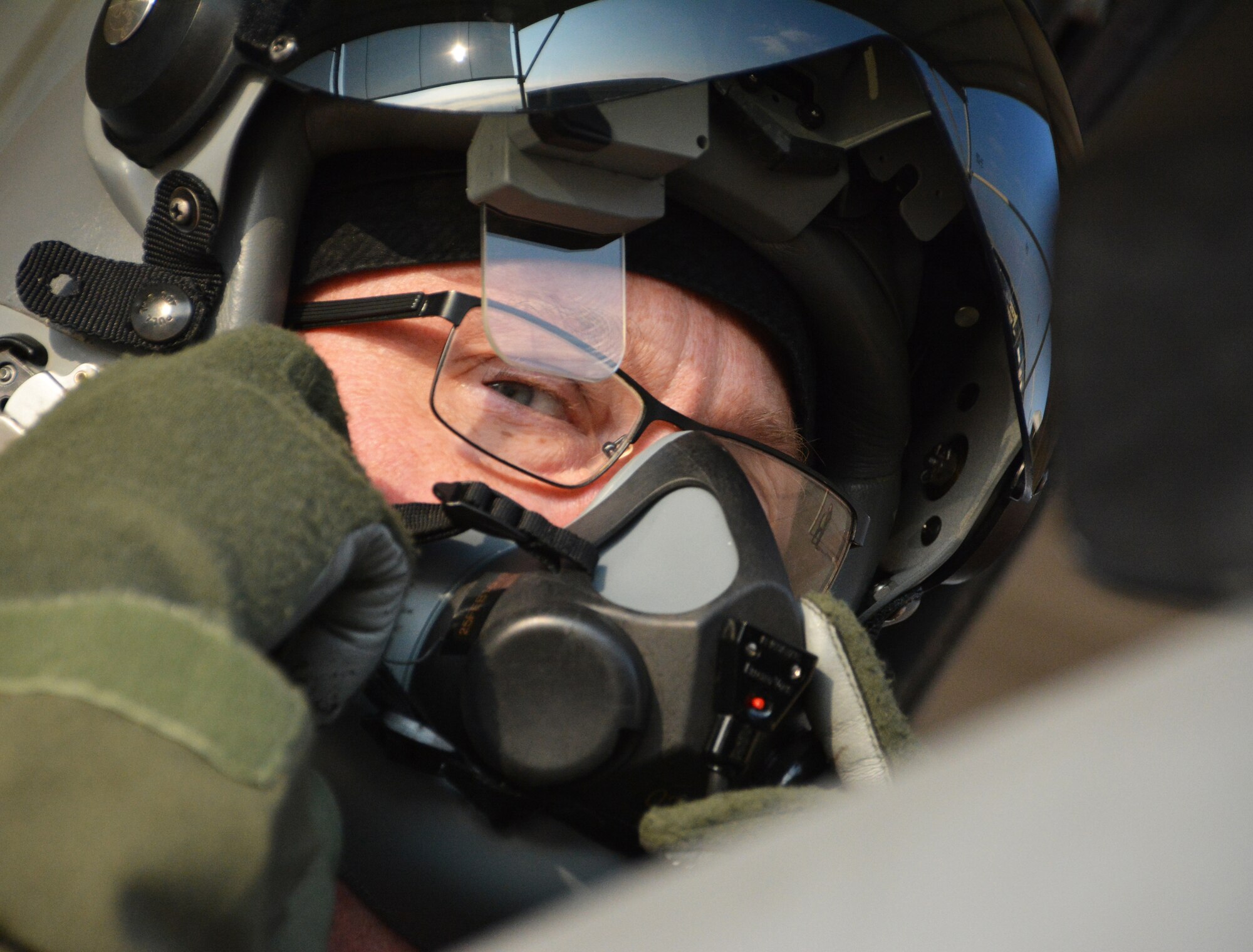 NAVAL AIR STATION FORT WORTH JOINT RESERVE BASE, Texas – Col. Robert Buchanan, 301st Fighter Wing vice commander, peers out from under his helmet here while preparing for take-off Feb. 6 in an F-16 for his final “fini-flight” after 28 years of service. Buchanan flew in 53 combat missions over Iraq and Afghanistan and deployed in support of operations Northern Watch, Southern Watch, Enduring Freedom and Iraqi Freedom. (U.S. Air Force photo by Staff Sgt. Samantha Mathison)