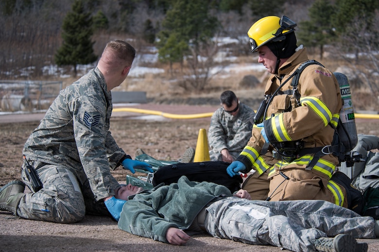 PETERSON AIR FORCE BASE, Colo. – Cheyenne Mountain Air Force Station firefighters respond to a simulated helicopter crash at CMAFS during the 16-2 Condor Crest Exercise on Feb. 19, 2016. The exercise tested the 21st Space Wing and associate units’ response to several incidents during the week-long exercise. (U.S. Air Force photo by Craig Denton)