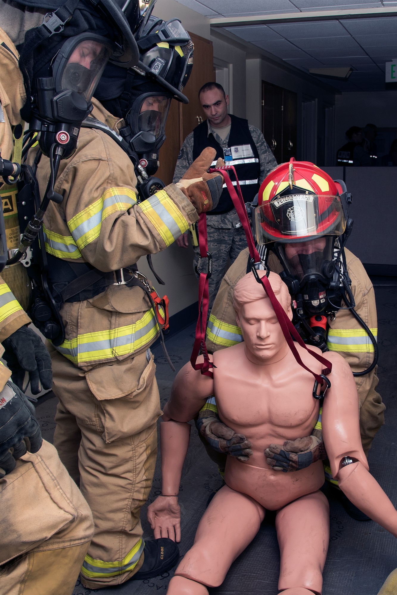 PETERSON AIR FORCE BASE, Colo. – Peterson firefighters respond to a simulated building explosion and resulting fire here during the 16-2 Condor Crest Exercise on Feb. 18, 2016. The exercise tested the 21st Space Wing and associate units’ response to several incidents during the week-long exercise. (U.S. Air Force photo by Craig Denton)