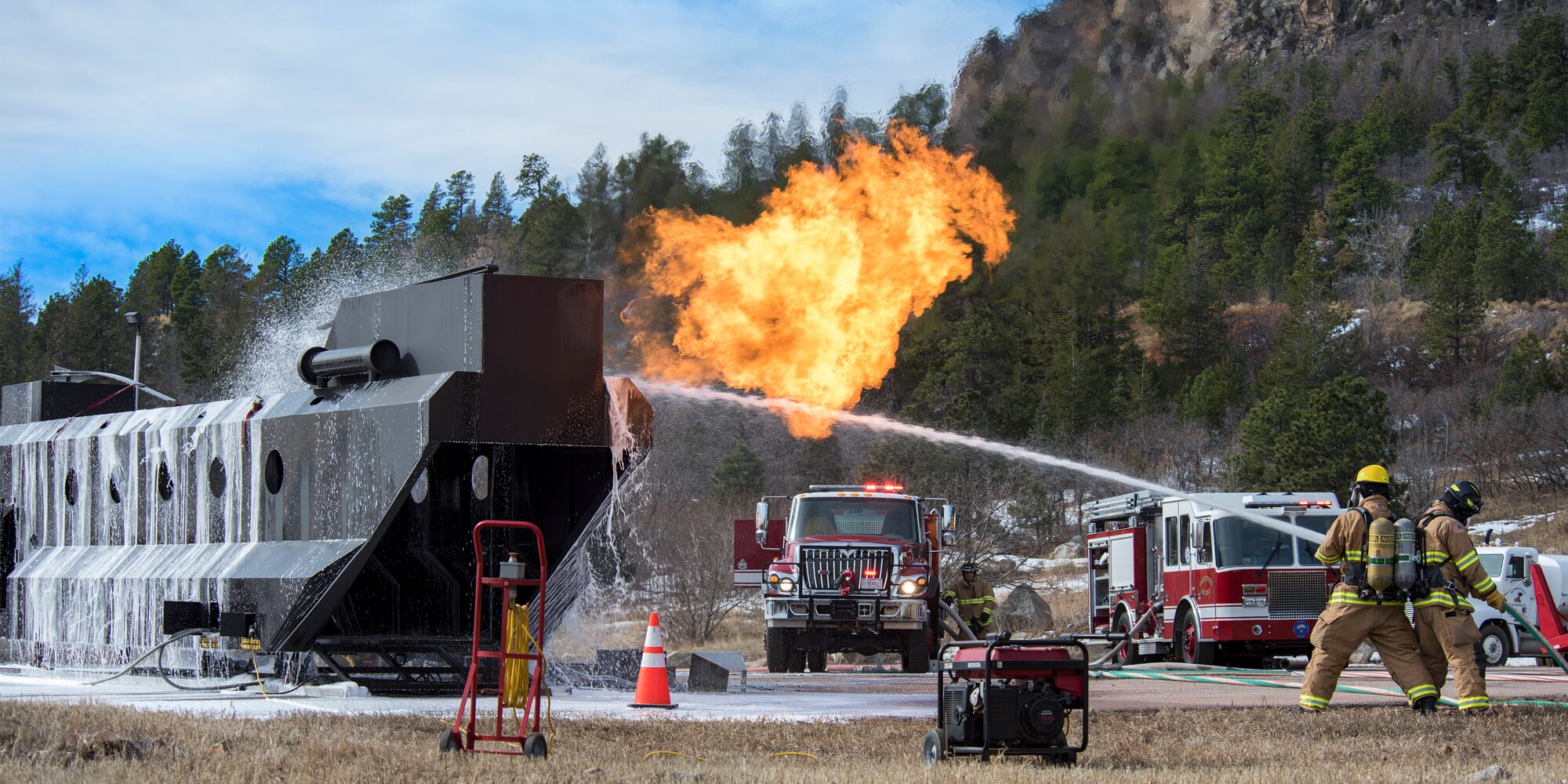 PETERSON AIR FORCE BASE, Colo. – Cheyenne Mountain Air Force Station firefighters respond to a simulated helicopter crash at CMAFS during the 16-2 Condor Crest Exercise on Feb. 19, 2016. The exercise tested the 21st Space Wing and associate units’ response to several incidents during the week-long exercise. (U.S. Air Force photo by Craig Denton)