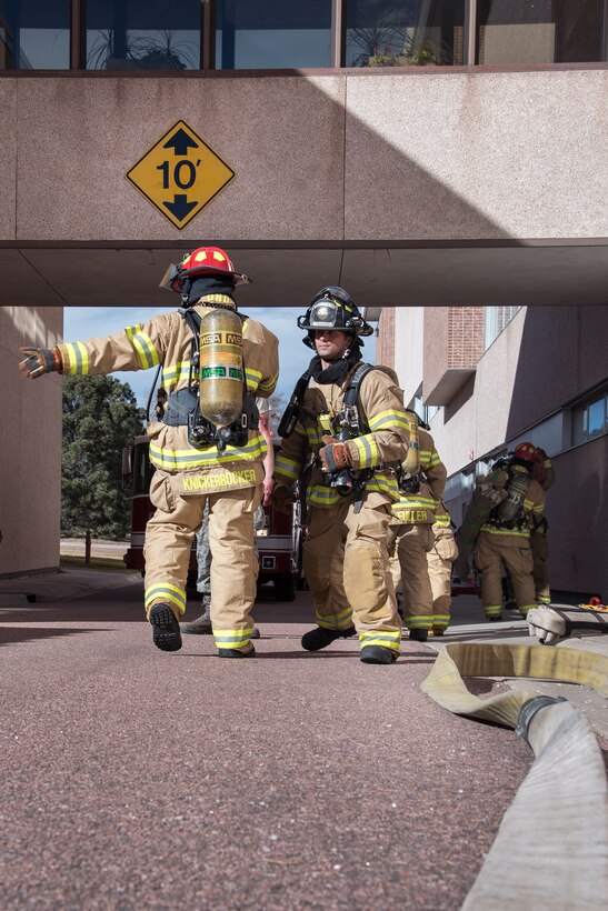 PETERSON AIR FORCE BASE, Colo. – Peterson firefighters respond to a simulated building explosion and resulting fire here during the 16-2 Condor Crest Exercise on Feb. 18, 2016. The exercise tested the 21st Space Wing and associate units’ response to several incidents during the week-long exercise. (U.S. Air Force photo by Craig Denton)