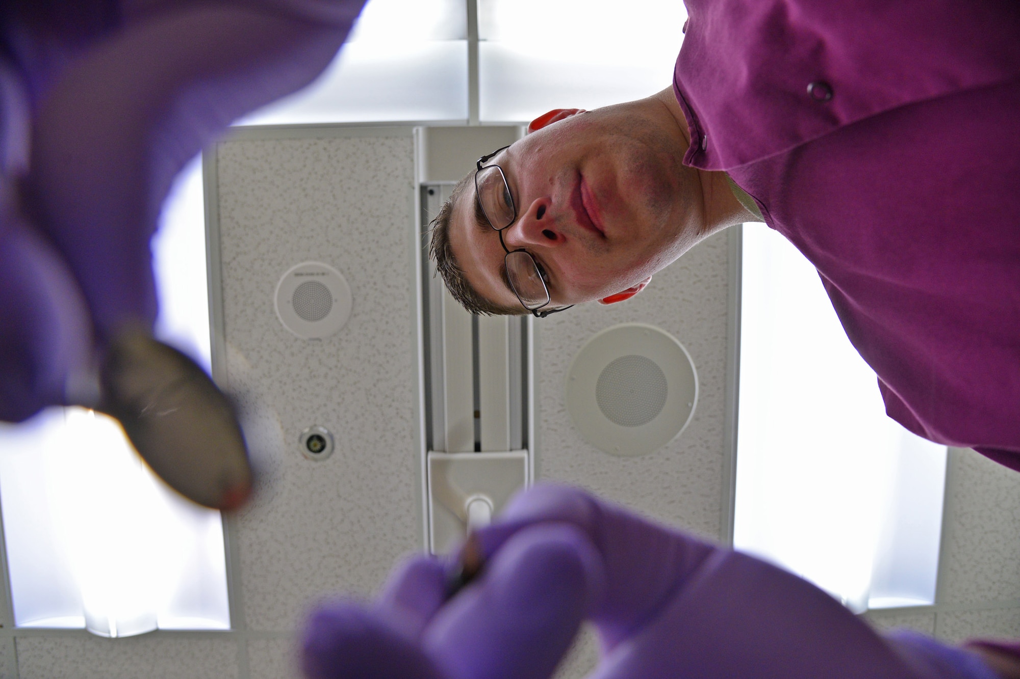 Senior Airman Cody Lemon, 341st Medical Operations Squadron dental assistant, simulates the use of teeth cleaning tools Feb. 22, 2016, at Malmstrom Air Force Base, Mont. Lemon is also the NCO in charge of infection control and oversees the decontaminating, sanitizing and testing of the medical equipment used on patients each day. (U.S. Air Force photo/Airman Daniel Brosam)