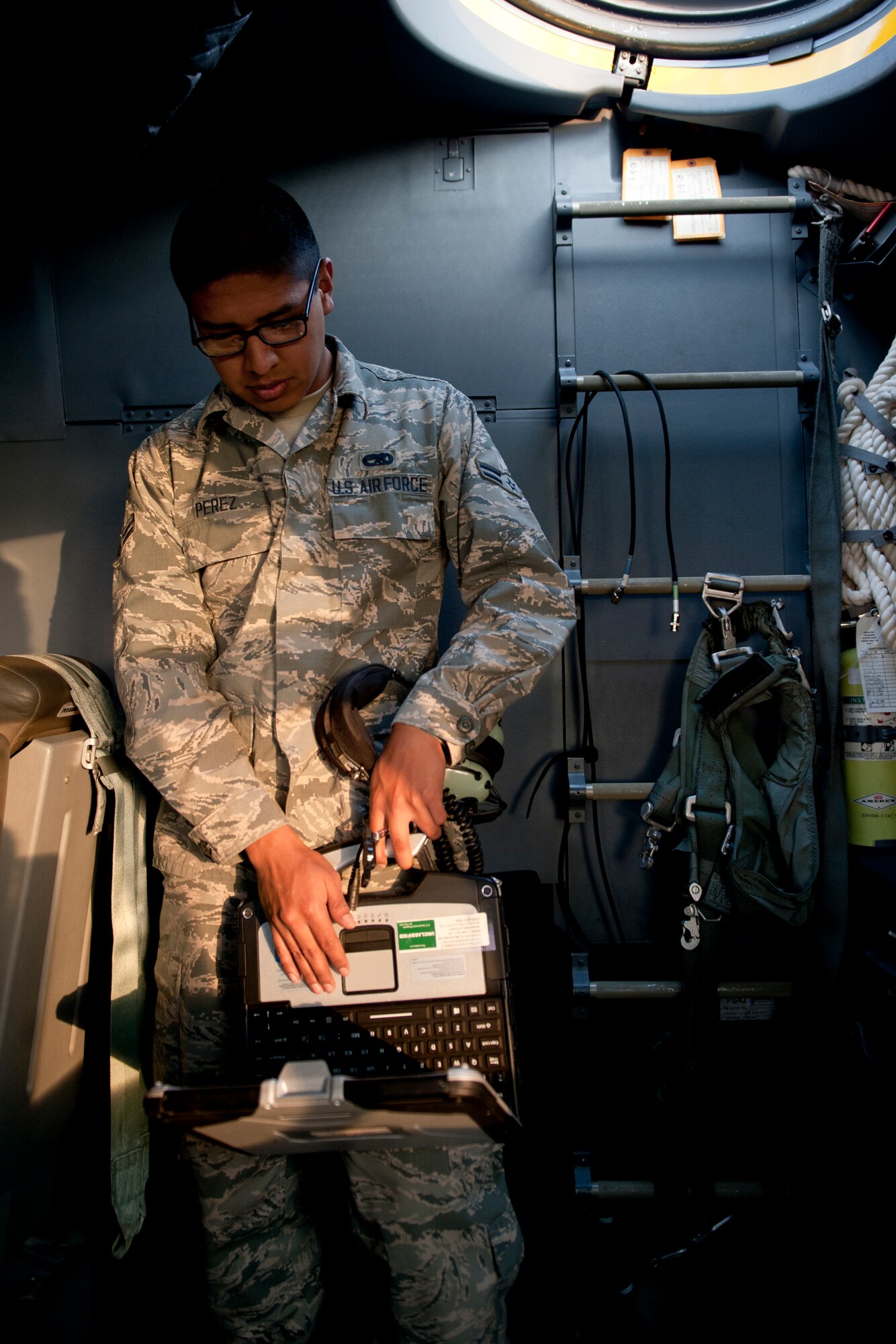 U.S. Air Force Airman 1st Class Yoan Perez, 353rd Special Operations Maintenance Squadron MC-130J Commando II crew chief, performs a final inspection of the aircraft during a training exercise Feb. 17, 2016, at Kadena Air Base, Japan. Perez ensured the aircraft's maintenance checklists were completed and performed final maintenance tasks prior to launch. (U.S. Air Force photo by Senior Airman Peter Reft)