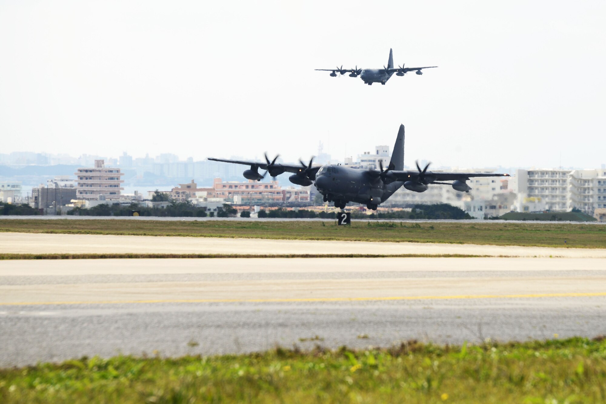 A U.S. Air Force MC-130J Command II's assigned to the 17th Special Operations Squadron lands at Kadena Air Base, Japan Feb. 17, 2016. The 17th SOS conducted a unit-wide training exercise which tasked the entire squadron with a quick-reaction, full-force sortie involving a five-ship formation flight, cargo drops, short runway landings and takeoffs, and helicopter air-to-air refueling. (U.S. Air Force photo by Master Sgt. Kristine Dreyer)