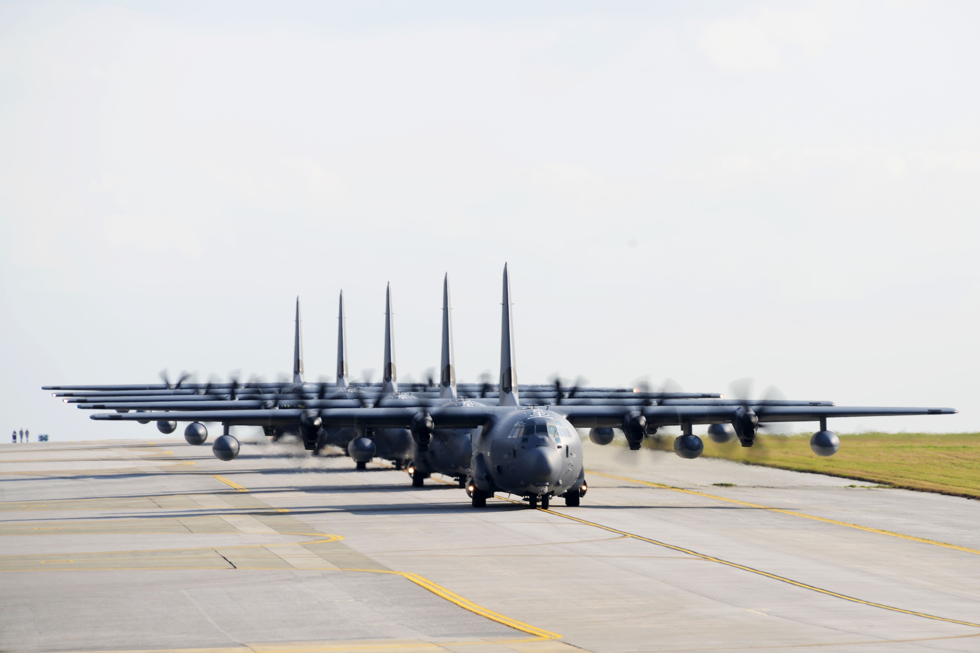 U.S. Air Force MC-130J Command II's assigned to the 17th Special Operations Squadron taxi down the runway Feb. 17, 2016, at Kadena Air Base, Japan. The 17th SOS conducted a unit-wide training exercise which tasked the entire squadron with a quick-reaction, full-force sortie involving a five-ship formation flight, cargo drops, short runway landings and takeoffs, and helicopter air-to-air refueling. (U.S. Air Force photo by Master Sgt. Kristine Dreyer)