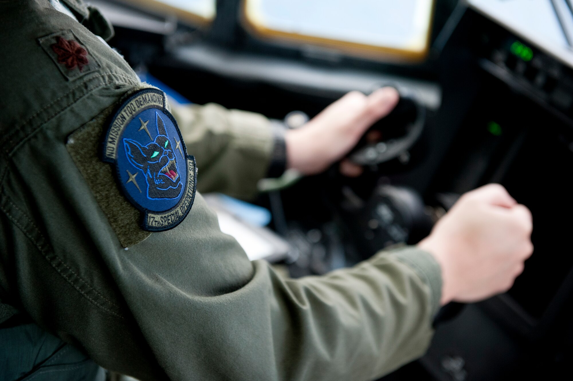 U.S. Air Force Maj. Brad Talley, 17th Special Operations Squadron MC-130J Commando II instructor pilot, leads a five-ship formation flight Feb. 17, 2016, off the coast of Okinawa, Japan. Talley and the 17th SOS Jakals simulated a quick-reaction, full-force sortie involving cargo drops, short runway landings and takeoffs, and helicopter air-to-air refueling. (U.S. Air Force photo by Senior Airman Peter Reft)