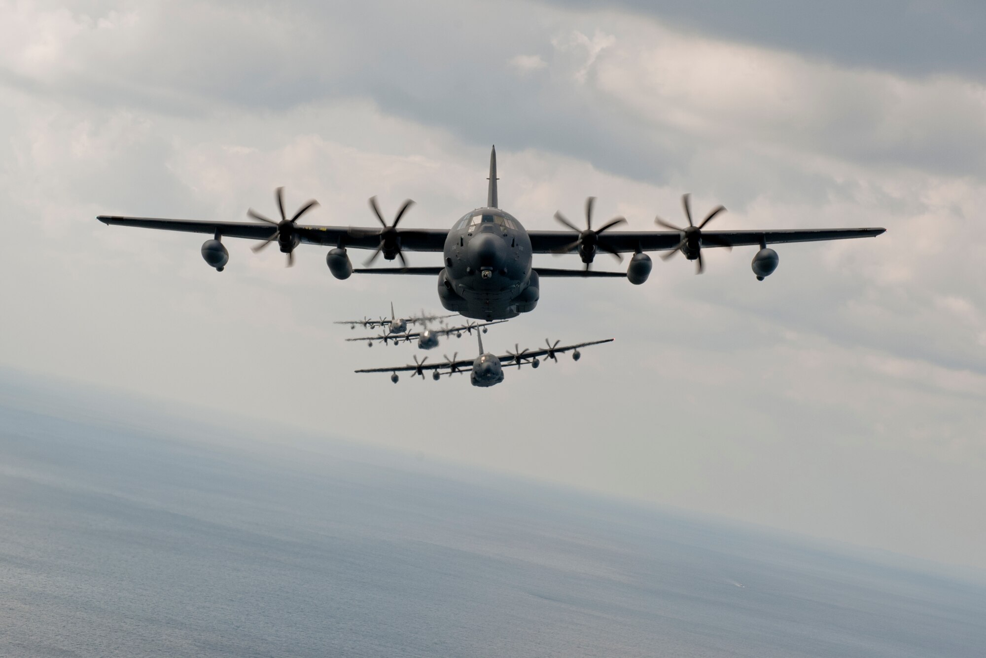 U.S. Air Force MC-130J Command II's assigned to the 17th Special Operations Squadron fly in formation Feb. 17, 2016, off the coast of Okinawa Japan. The 17th SOS conducted a unit-wide training exercise which tasked the entire squadron with a quick-reaction, full-force sortie involving a five-ship formation flight, cargo drops, short runway landings and takeoffs, and helicopter air-to-air refueling. (U.S. Air Force photo by Senior Airman Peter Reft)