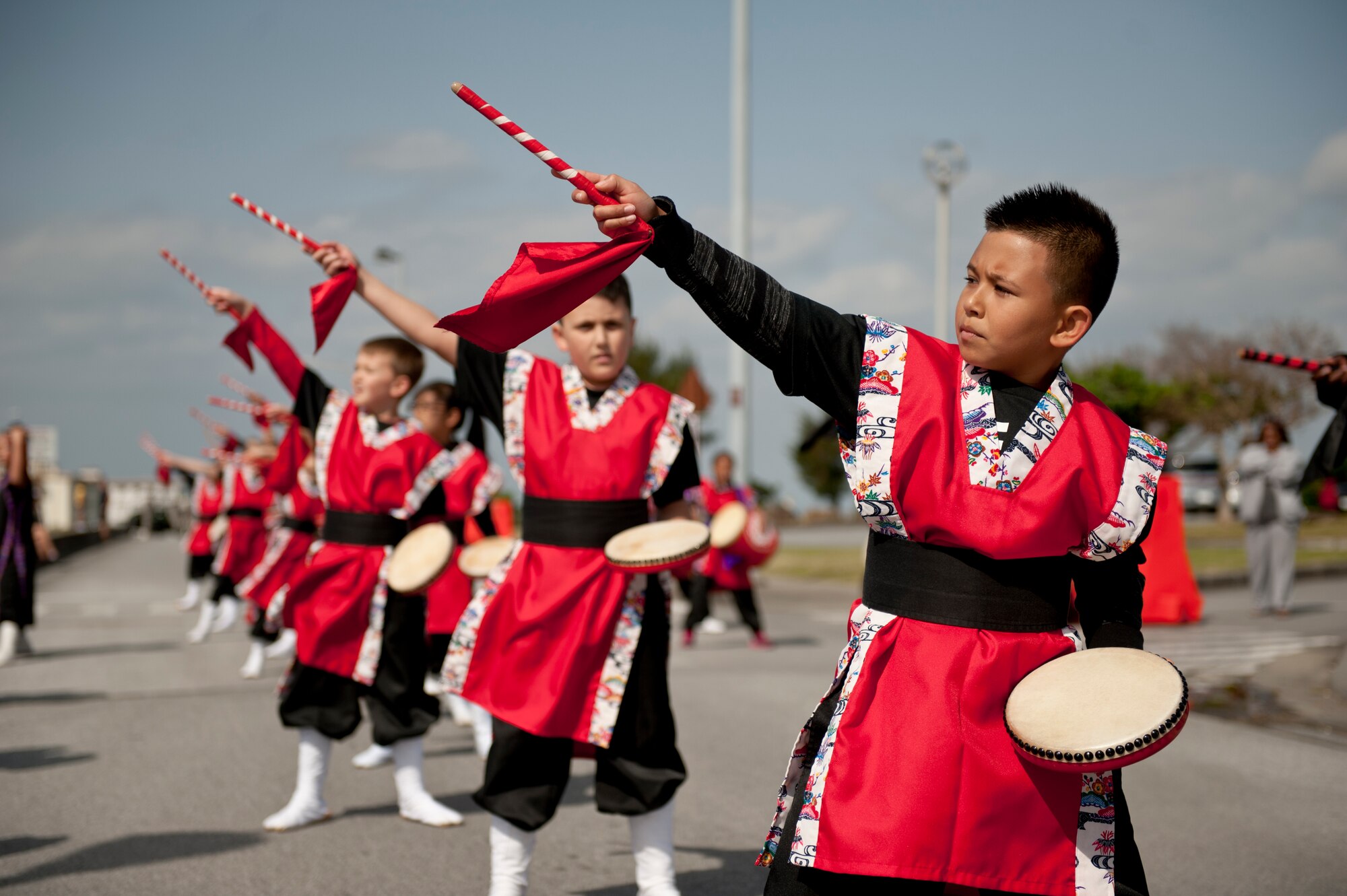 Students from the Amelia Earhart Intermediate School cheer on runners during the Okinawa Marathon Feb. 21, 2016, at Kadena Air Base, Japan. Students performed a variety of drum and dance routines as runners entered the base. (U.S. Air Force photo by Senior Airman Peter Reft)