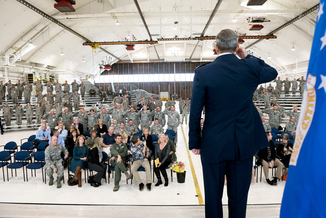 Lt. Col. Mitchell Neff salutes his new group after taking command of the 140th Maintenance Group from Col. Brian Patterson. (U.S. Air National Guard photo by Staff Sgt. Michelle Alvarez-Rea)