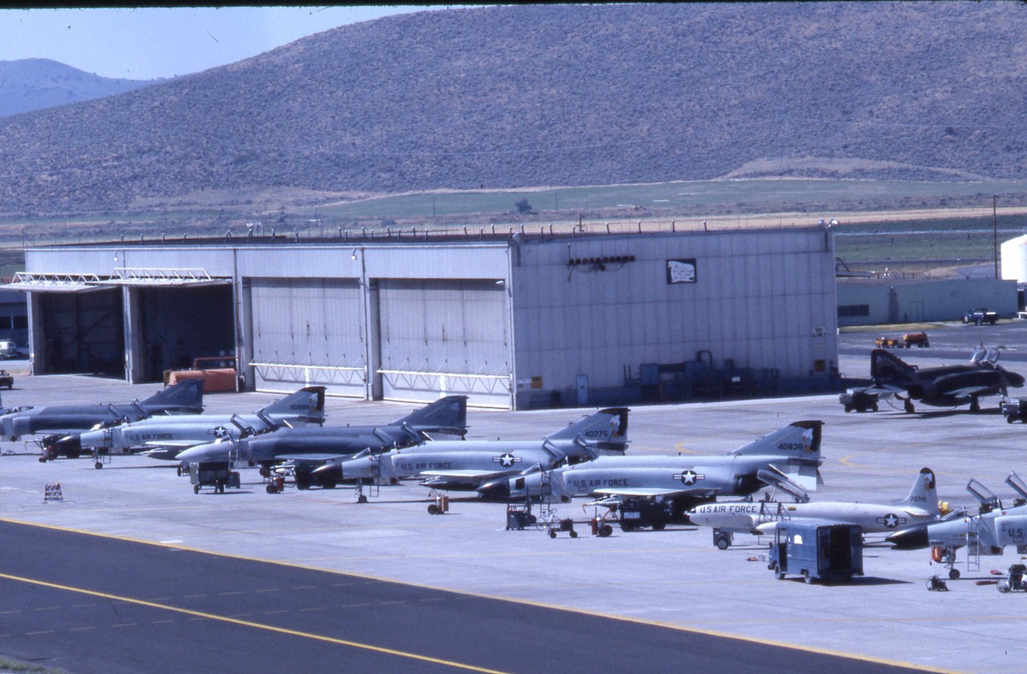 Members of the 114th Tactical Fighter Training Squadron prepare the F-4 Phantoms for a training mission at Kingsley Field in Klamath Falls, Oregon in 1986.  An F-4 training schoolhouse for Air National Guard pilots and WSOS was opened at Kingsley Field in 1985. (U.S. Air National Guard file photo/released)