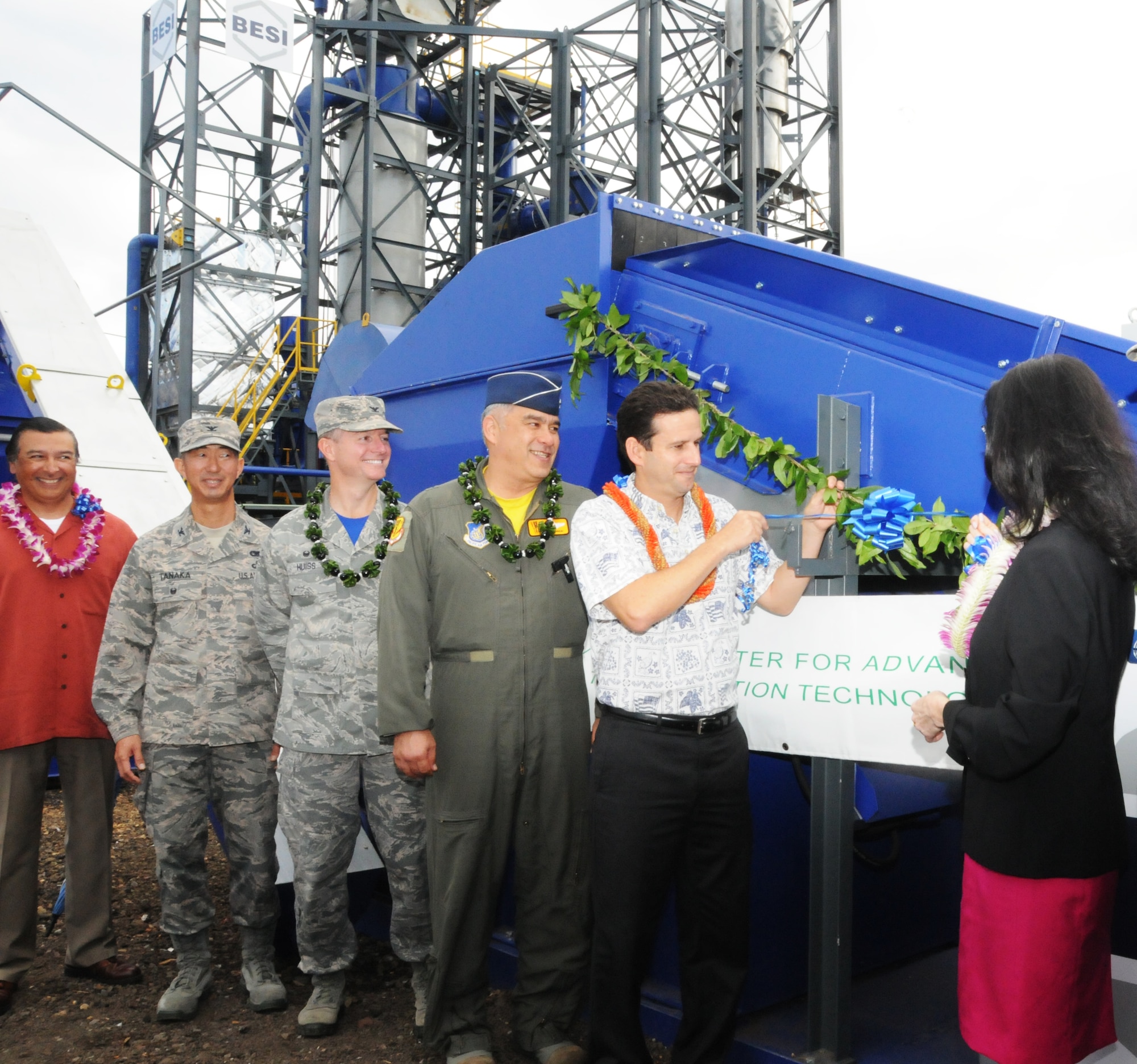 U.S. Senator Brian Schatz pulls the ribbon at the unveiling ceremony of a new $6.8 million waste to energy system at Joint Base Pearl Harbor-Hickam, Hawaii, Feb. 19, 2016.  The new system is one part of the Hawaii Air National Guard's renewable energy strategy. The Air Force Research Labs selected the Hawaii Air National Guard’s 154th Wing to demonstrate an integrated microgrid concept that tests the viability of using renewable energy and microgrids to assure that the Air Force can continue mission critical operations regardless of the state of the public utility grid or cyber-attack. (U.S. Air National Guard photo by Senior Airman Orlando Corpuz/released)