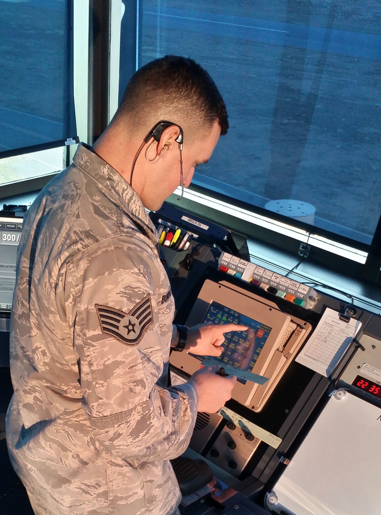 U.S. Air Force Staff Sgt. Jacob Burkhalter, Tower Watch Supervisor for the 235th Air Traffic Control Squadron, operates an Enhanced Terminal Voice Switch (ETVS) allowing quick access to pre-programed radio frequencies and telephone lines during daily operations, Feb 10, 2016. Burkhalter is able to monitor all frequencies and positions at the same time making his response quicker and more efficient in case of a miscommunication. Burkhalter, who was recently selected as 2015 Air Traffic Controller of the Year, provides air traffic control services for all civilian and military aircraft at Stanly County Airport, in New London, N.C. (U.S. Air National Guard photo by Tech. Sgt. Alex McCorkle/Released)