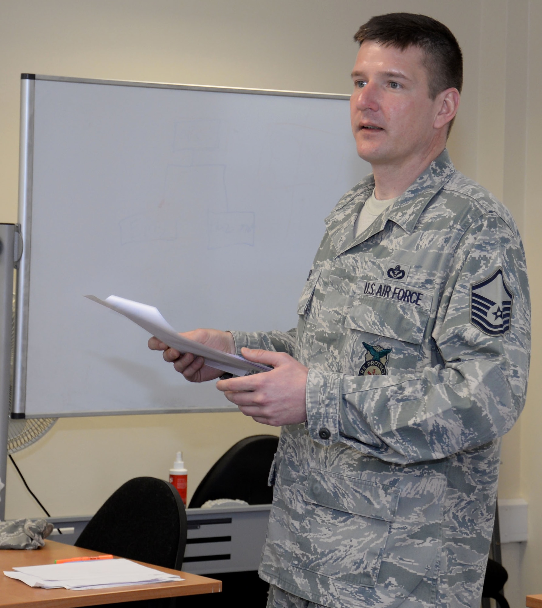 U.S. Air Force Master Sgt. Michael Wobser, 100th Civil Engineer Squadron Fire Department assistant chief of operations, goes through the results of a test during a National Incident Management System 300/400 course Feb. 18, 2016, on RAF Mildenhall, England. The topics in the class covered many areas of emergency management including initial response, resource management and planning. (U.S. Air Force photo by Gina Randall/Released)