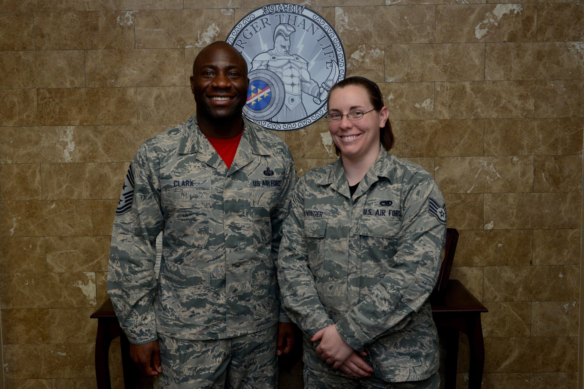 Chief Master Sgt. Vegas Clark, 39th Air Base Wing command chief, stands with Staff Sgt. Michele Waninger, 39th Maintenance Squadron aerospace ground equipment technician, in the 39th ABW conference room before beginning Waninger’s chief shadow day Feb. 19, 2016. Airmen are chosen for the command chief’s shadow program based on their commander’s recommendation about their dedication to the mission and their job. (U.S. Air Force photo by Staff Sgt. Michael Battles)
