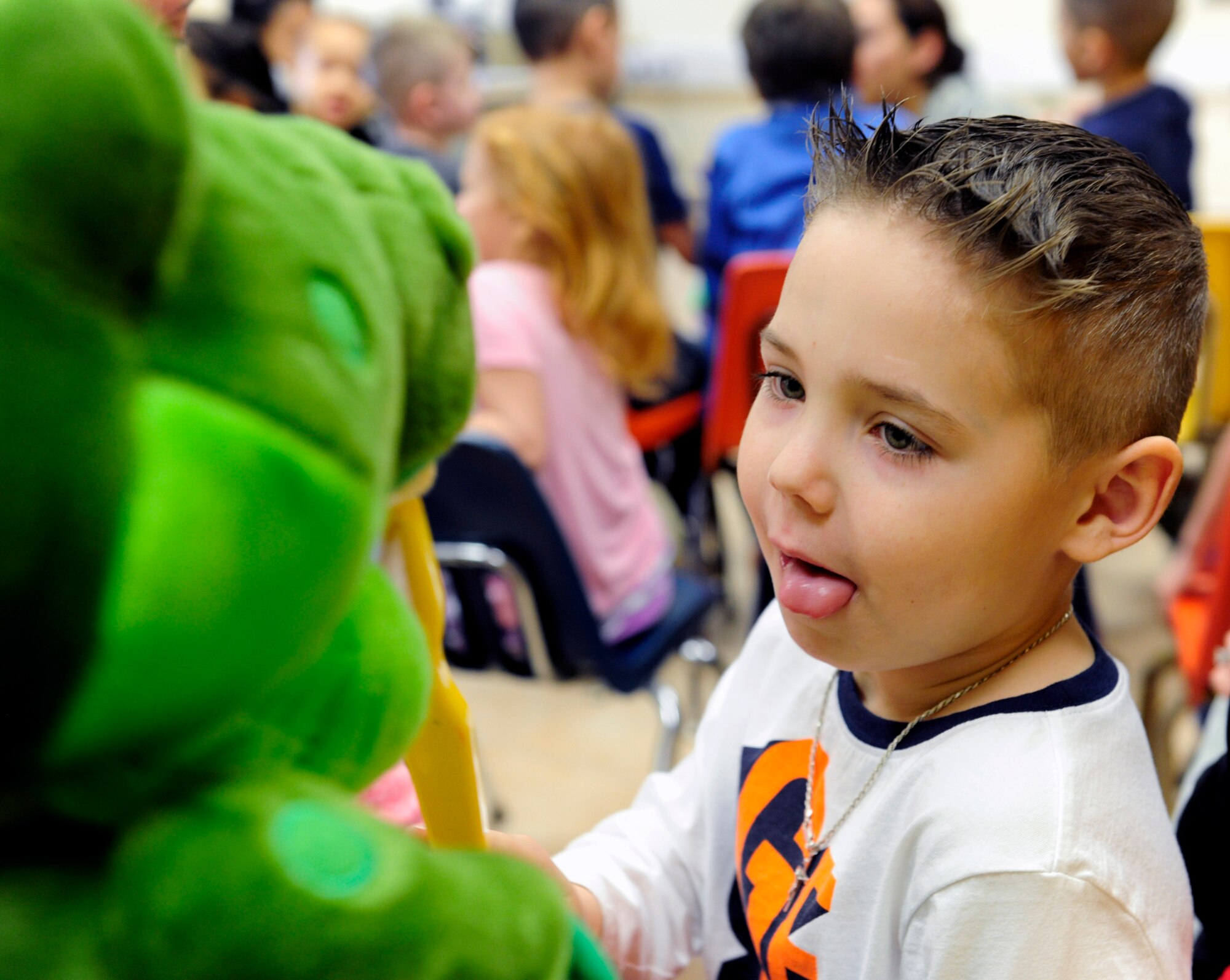 A child at Incirlik Unit School demonstrates proper toothbrush technique on a dinosaur puppet Feb. 19, 2016, at Incirlik Air Base, Turkey. Members of the 39th Medical Operations Squadron dental flight visited with elementary school children to discuss the importance of oral hygiene. (U.S. Air Force photo by Staff Sgt. Jack Sanders) 